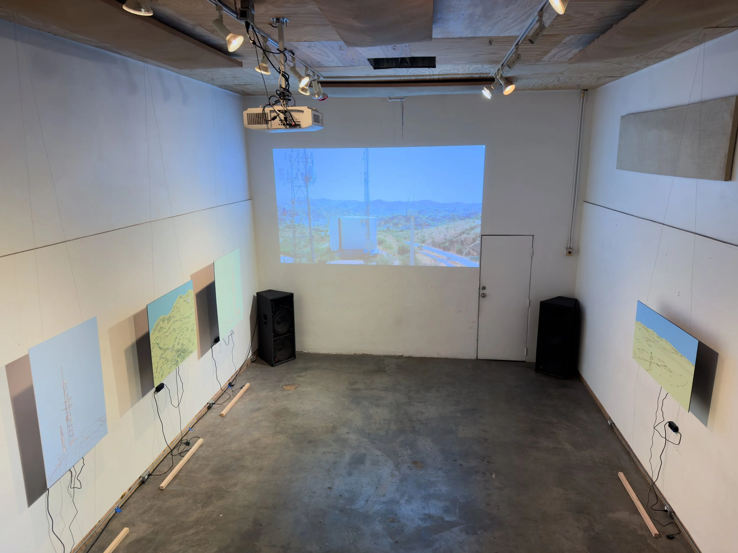 Video art by David Taylor (facing wall) and multimedia art by Robert Henderson, Border Signals Exhibit, October 2025